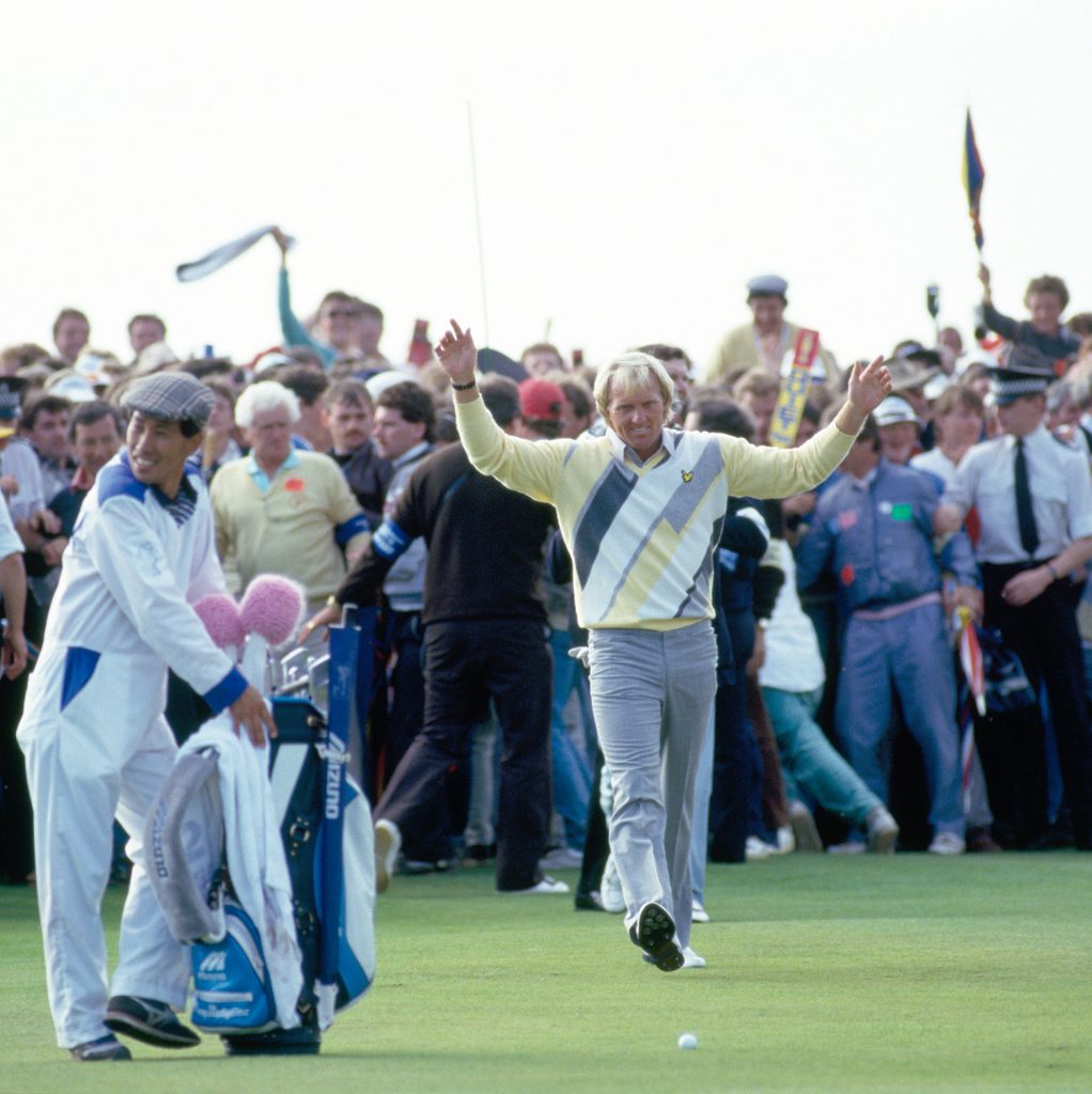 Greg Norman of Australia (centre) acknowledges the crowd on the 18th fairway during the final round of the British Open Golf Championship held at the Turnberry Golf Resort, Scotland, 20th July 1986. Greg Norman won the Championship by 5 strokes. (Photo by Phil Sheldon/Popperfoto/Getty Images)